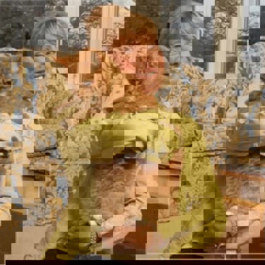 Jan leaming holding a ginger cat