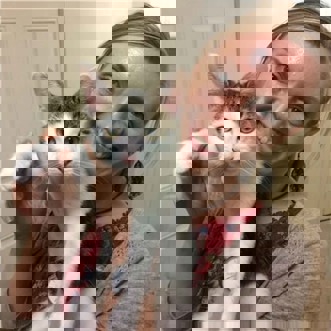 Volunteer Beki with foster cat Panda