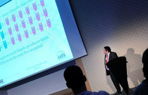 man delivering presentation about neutering cats